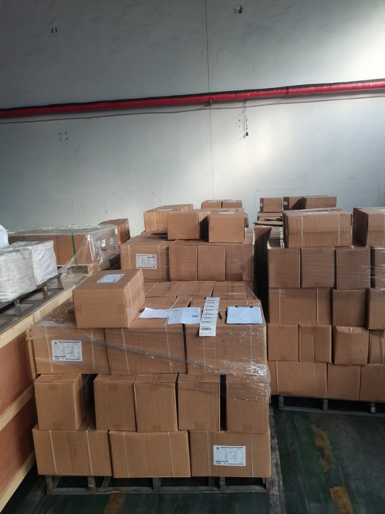 Palletised cartons wrapped and staged for freight